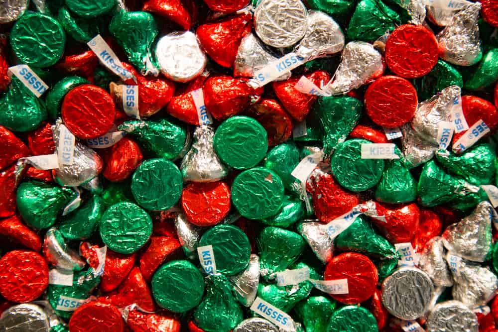 Red, Green, and silver Hersheys Kisses in a pile
