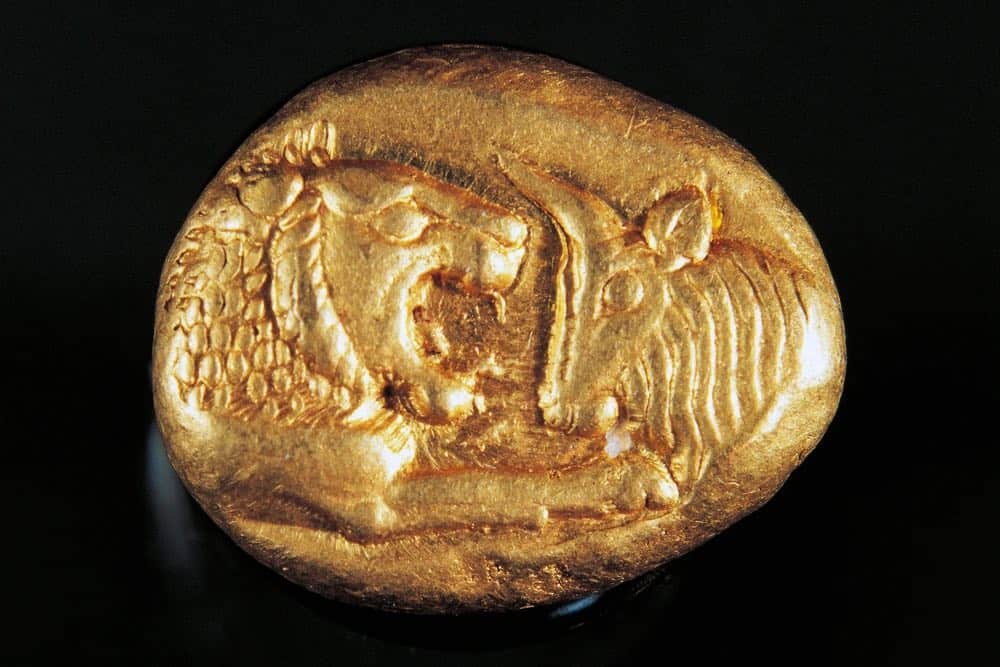 Ancient gold weight of measure with lion and lamb head stamp
