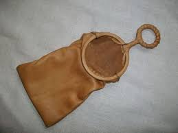 A replica of a bagging pocket purse in brown satin with a bamboo ring to hold it open